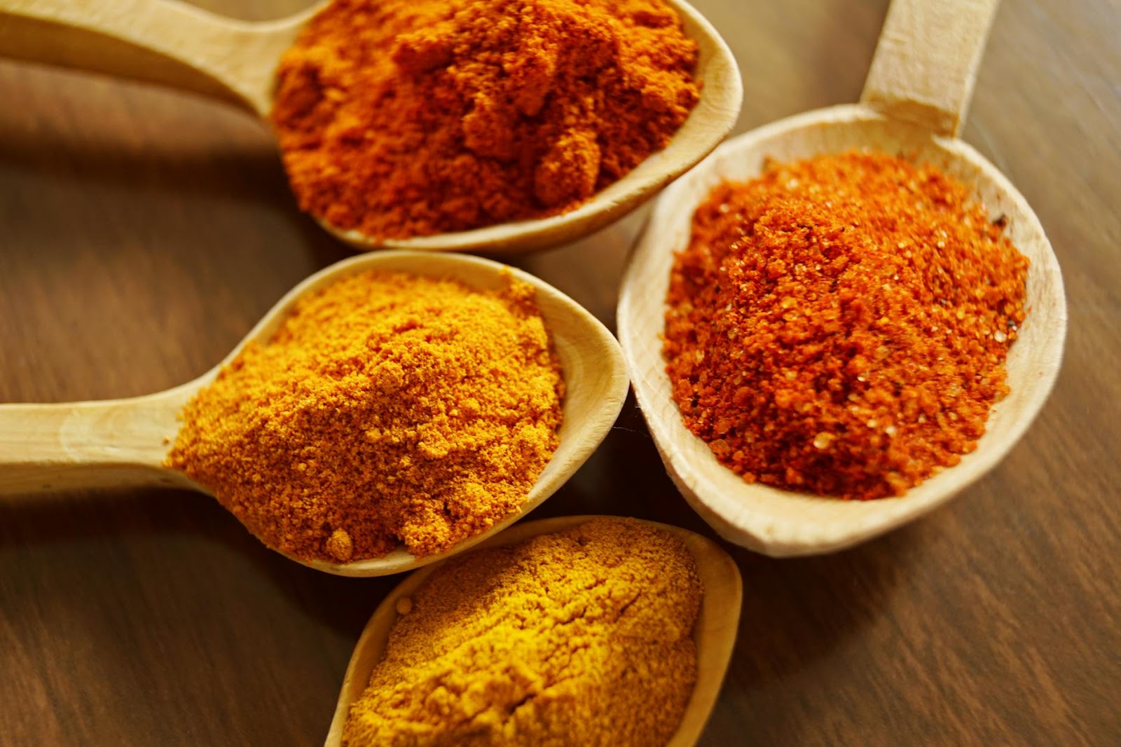 four-assorted-spices-on-wooden-spoons